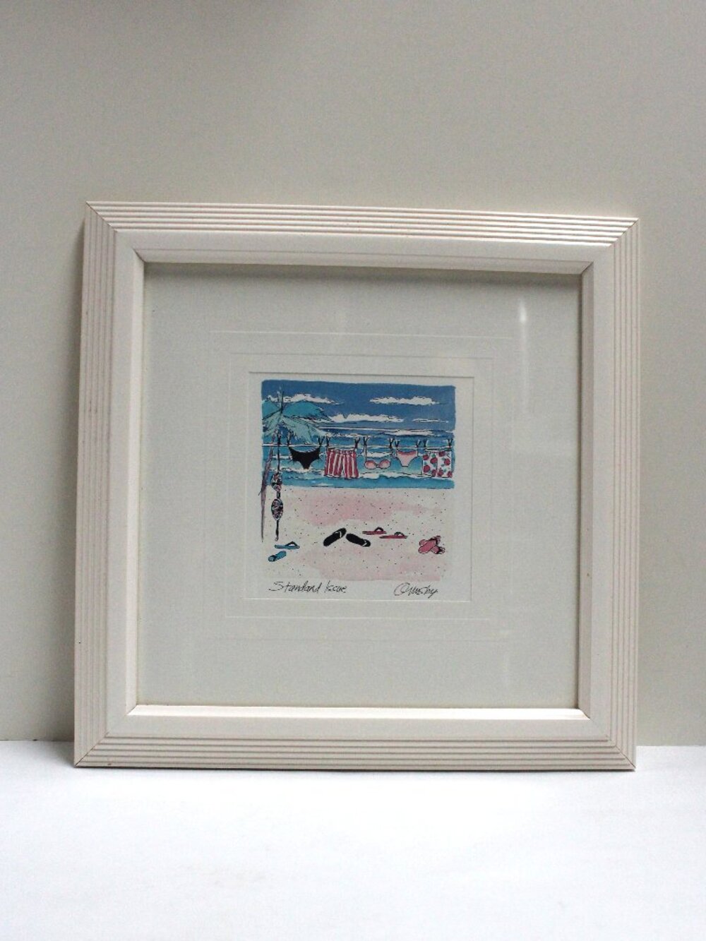 Standard Issue Beach Scene Matted and Framed Square Print by Anne Ormsby